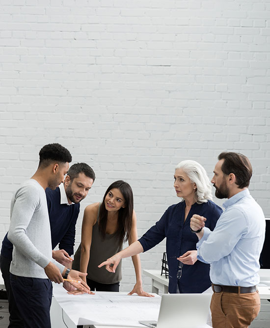 Group of serious business people having a brainstorm meeting