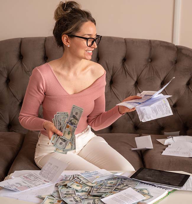 Happy Woman counting money at home. Investment opportunities, budget planning and future finances